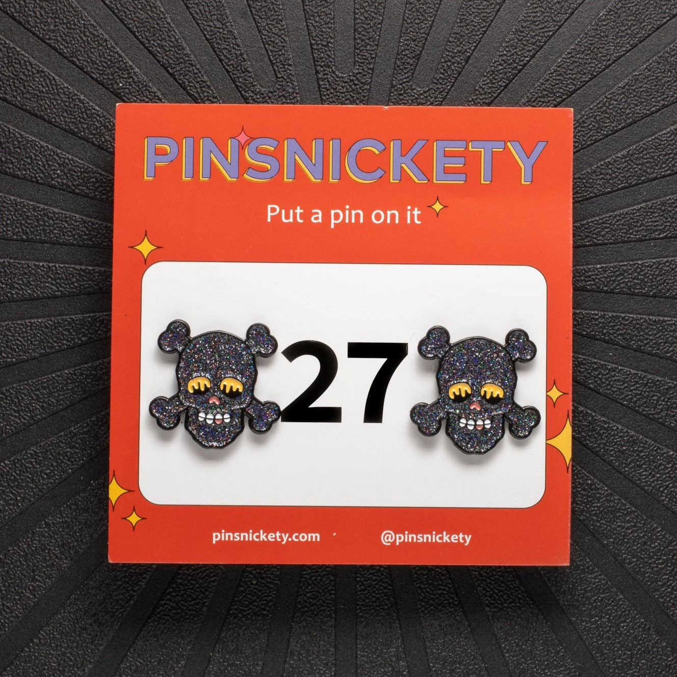 pinsnickety skull horse show number pin in special edition black on a black background and its product packaging card