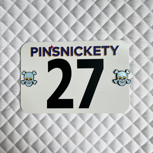 pinsnickety blue skull horse show number pins on a saddle pad