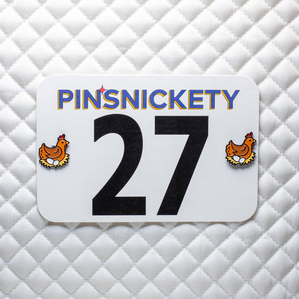 pinsnickety chicken horse show number pins on a saddle pad