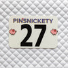 Pinsnickety Flying Pig horse show number pins on a saddle pad