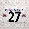 pinsnickety skull special edition pink horse show number pins on a saddle pad