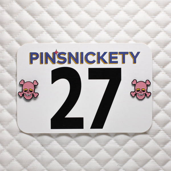 pinsnickety skull special edition pink horse show number pins on a saddle pad