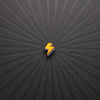 pinsnickety lightning bolt horse show number pin in special edition electric yellow alone on a black background